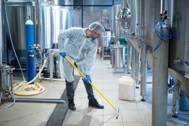 Professional cleaning an industrial facility