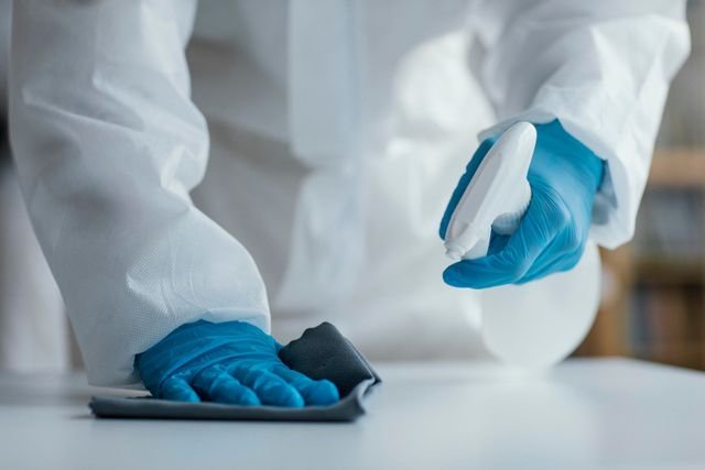 Professional disinfecting a healthcare environment